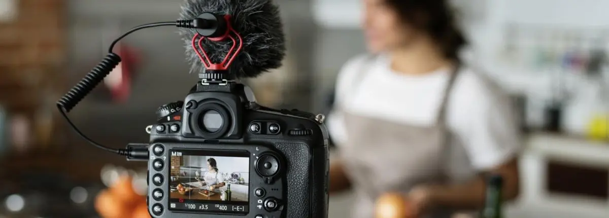 Woman recording video on her camera