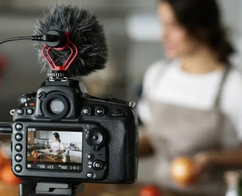 Woman recording video on her camera